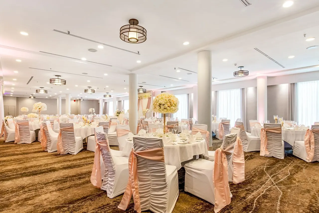Floral banquet tables in the Horizons ballroom at the Best Western Premier Calgary Plaza Hotel
