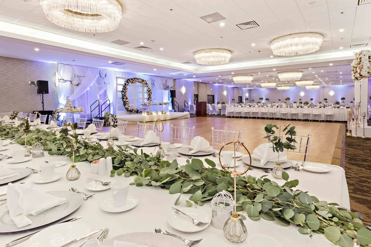 Floral table décor in a ballroom at the Best Western Premier Calgary Plaza Hotel
