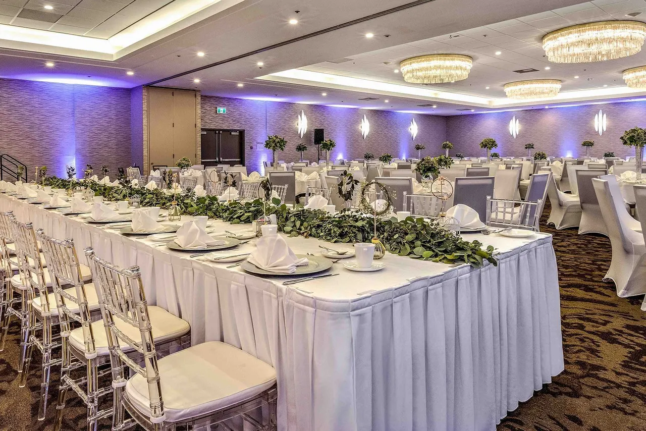 Floral table décor in a ballroom at the Best Western Premier Calgary Plaza Hotel